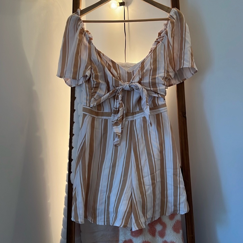 Francesca’s romper, never worn, tags still on.